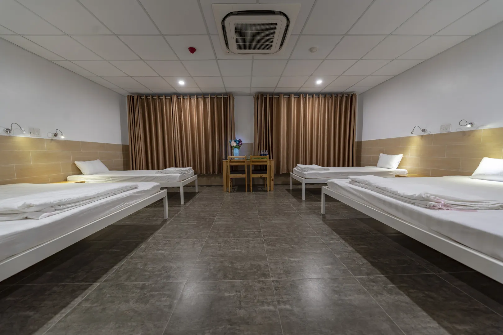 Mixed dorm room with 2 single and 2 double beds for up to 6 guests