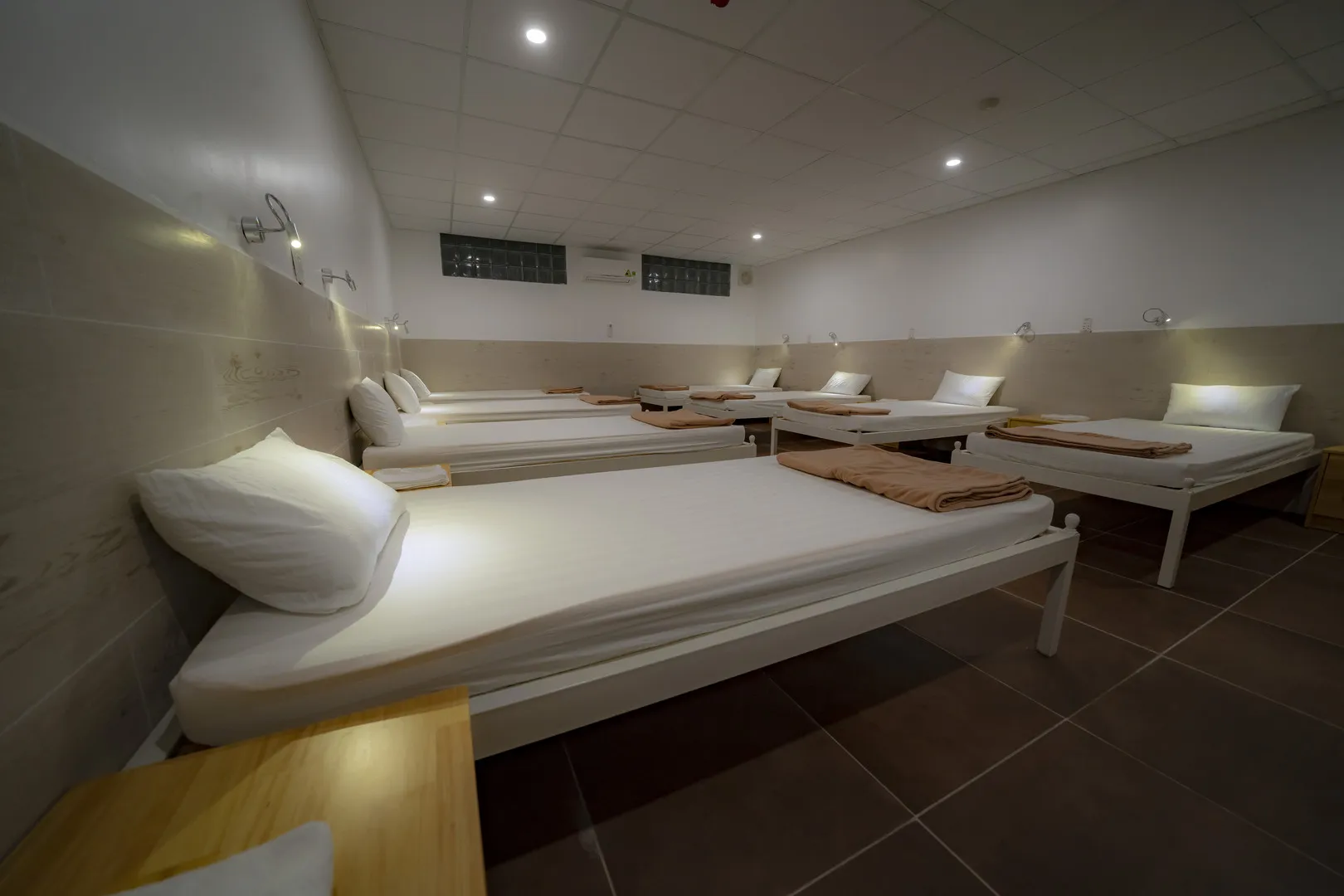 Shared room with 8 single beds for 8 guests